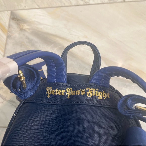 LOUNGEFLY NWT DISNEY PARKS MICKEY MAIN ATTRACTION PETER PAN’S FLIGHT BACKPACK - Picture 7 of 8